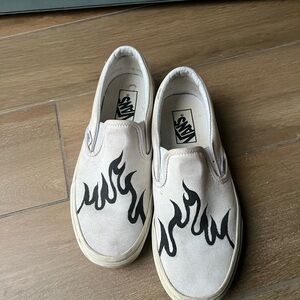 Vans White Slip-On Shoes with Black Flame Design